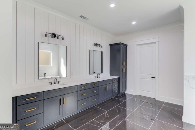 bathroom with vanity and ornamental molding