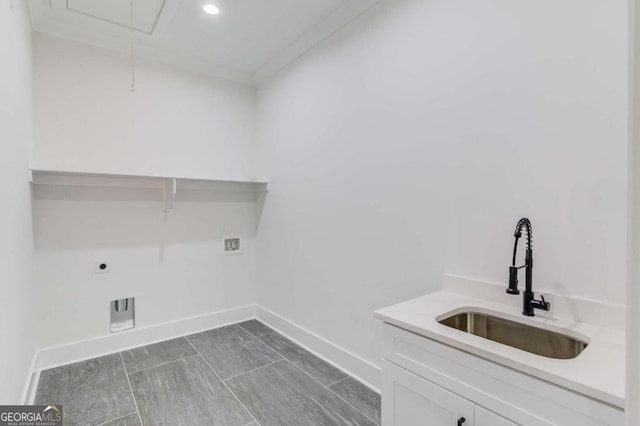 clothes washing area featuring hookup for an electric dryer, hookup for a washing machine, crown molding, and sink