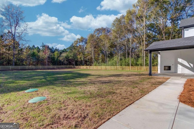 view of yard with a rural view