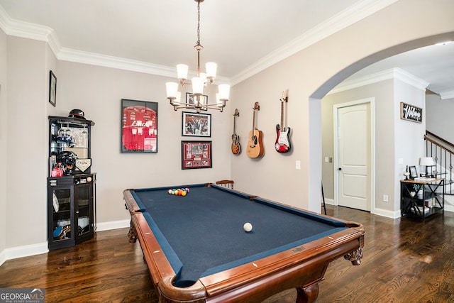 recreation room with dark hardwood / wood-style floors, ornamental molding, pool table, and a chandelier