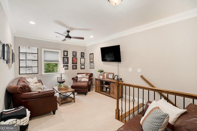 living area with light carpet, recessed lighting, baseboards, and crown molding