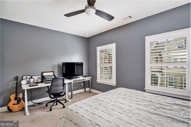 carpeted bedroom featuring ceiling fan