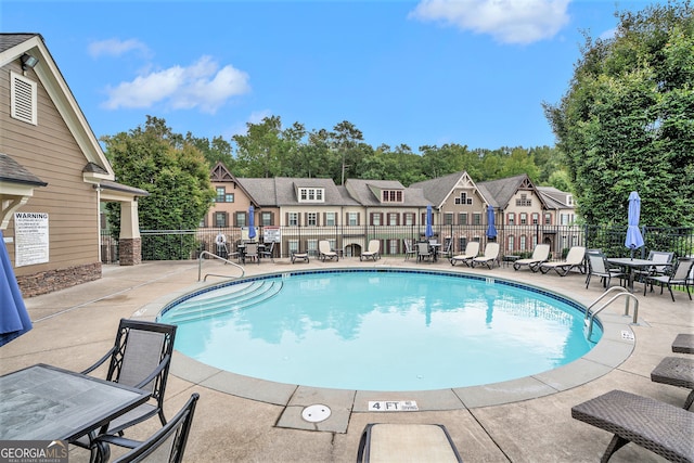 view of pool featuring a patio