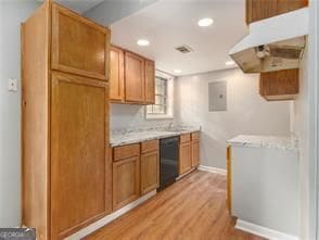 kitchen featuring dishwasher and light hardwood / wood-style flooring