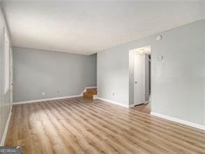 empty room featuring light hardwood / wood-style floors