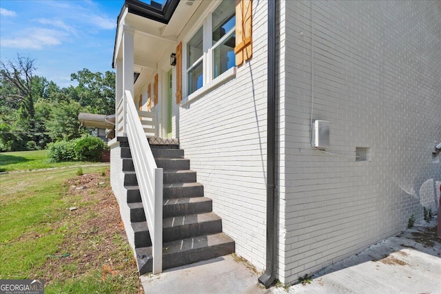 view of side of home featuring a yard