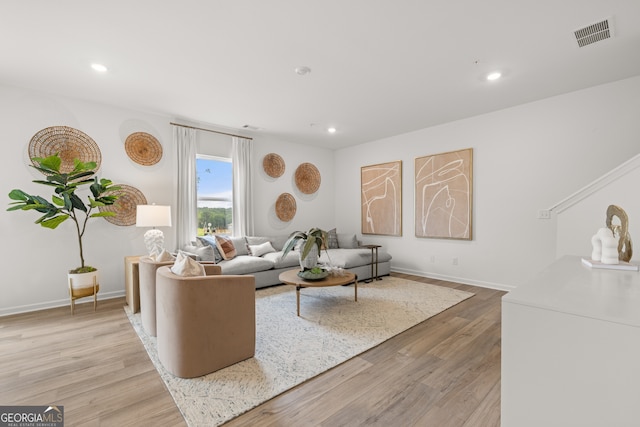 living room with light hardwood / wood-style floors