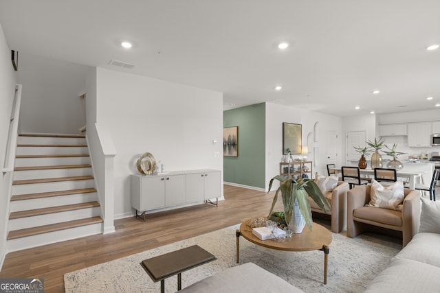 living room with light hardwood / wood-style flooring