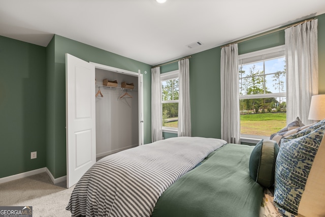 carpeted bedroom featuring a closet