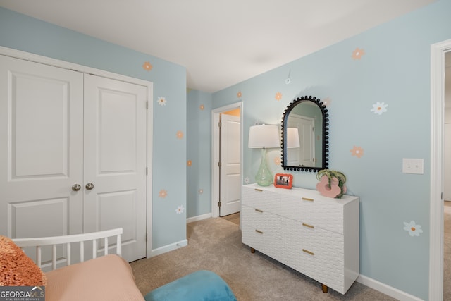 bedroom with light carpet and a closet