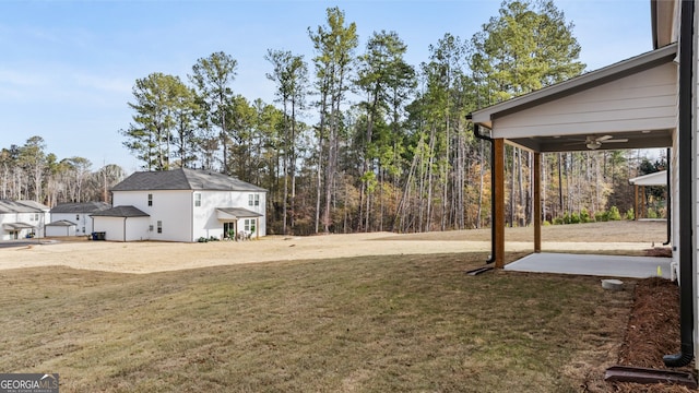 view of yard with ceiling fan