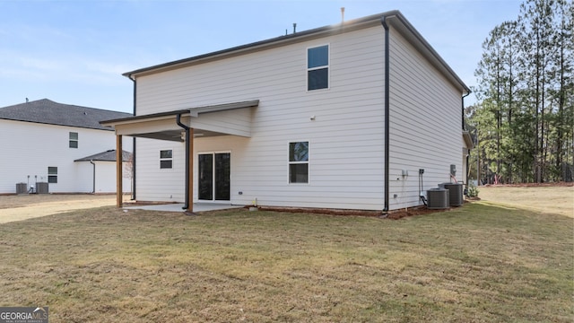 back of property featuring a patio, central AC unit, and a lawn