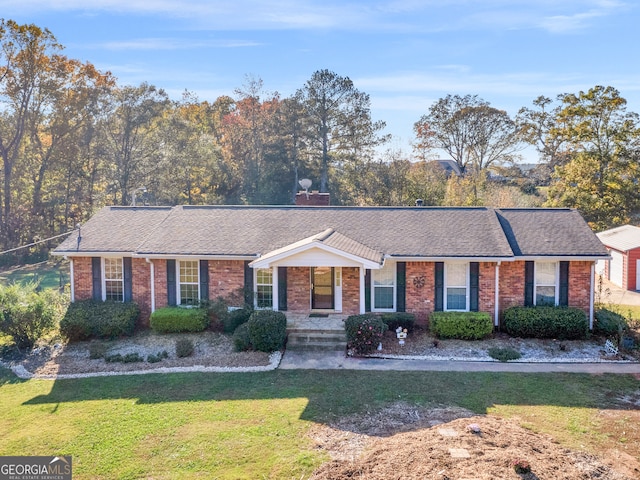 ranch-style home with a front yard