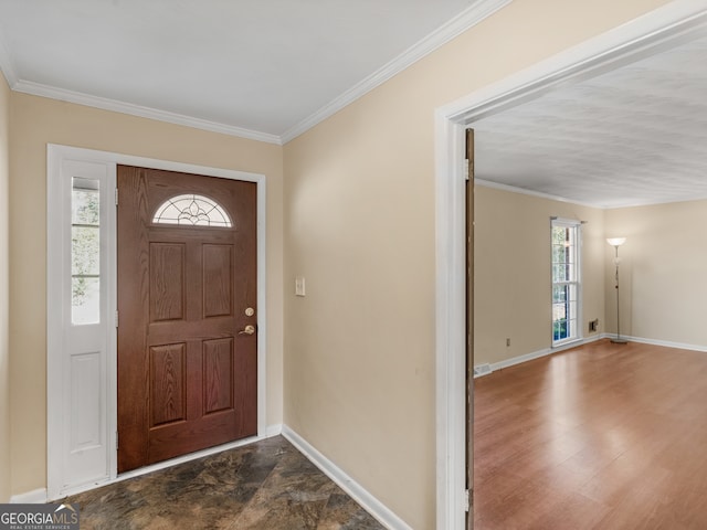 foyer featuring plenty of natural light, dark hardwood / wood-style floors, and ornamental molding