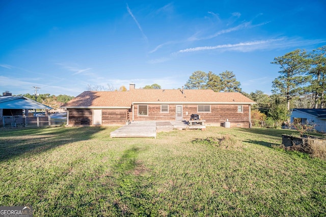 rear view of house featuring a lawn and a patio area