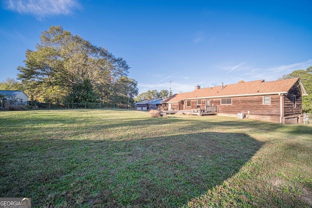 view of yard featuring a wooden deck