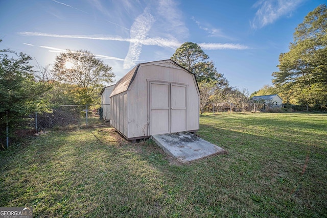 view of outdoor structure with a lawn