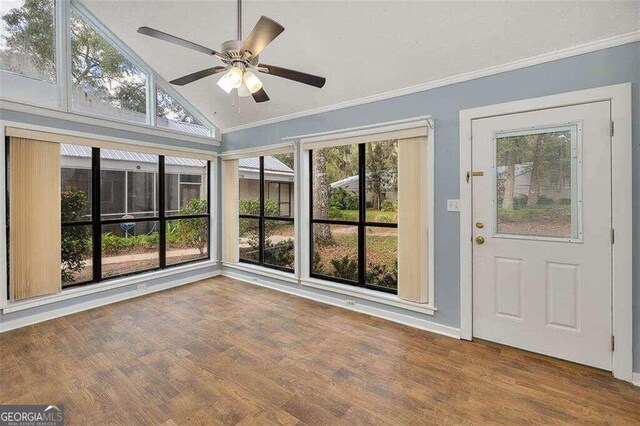 unfurnished sunroom featuring vaulted ceiling and ceiling fan