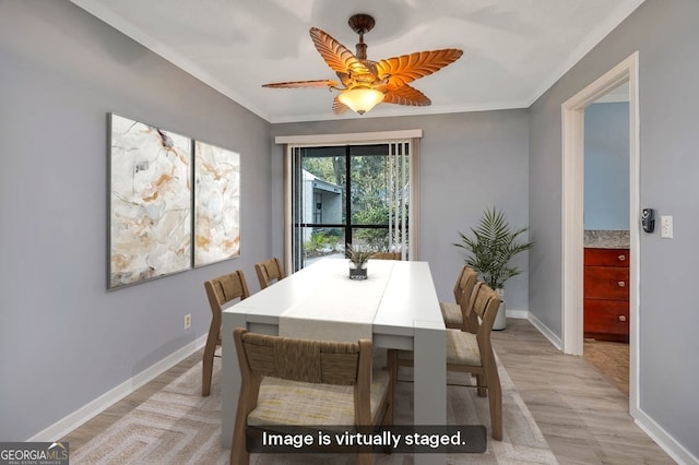 dining area with crown molding, ceiling fan, and light hardwood / wood-style floors