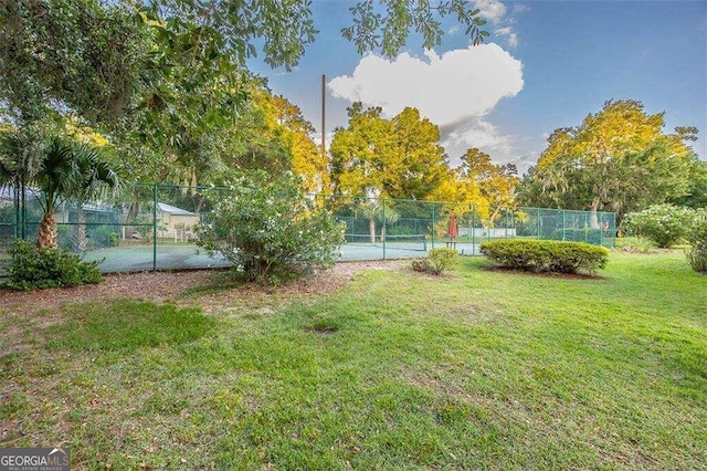 view of yard featuring tennis court