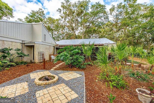 view of patio with a fire pit