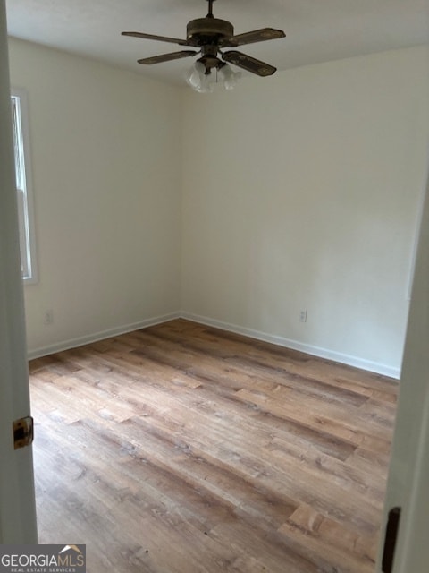 spare room featuring ceiling fan and light hardwood / wood-style flooring