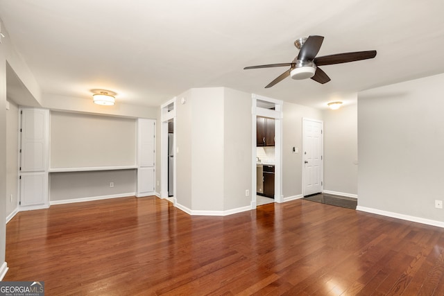 empty room featuring hardwood / wood-style floors and ceiling fan