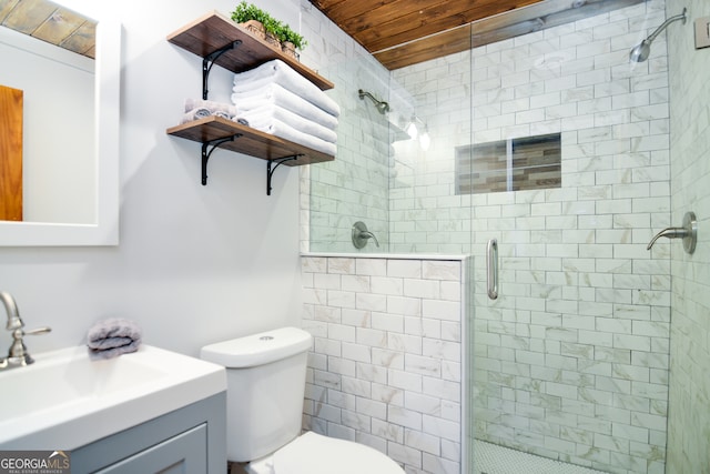 bathroom featuring vanity, toilet, wood ceiling, and walk in shower