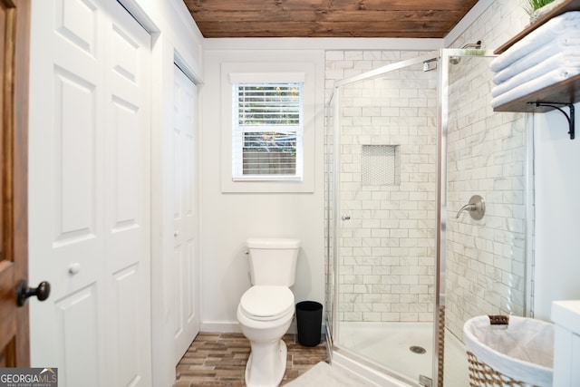 bathroom with hardwood / wood-style floors, toilet, walk in shower, and wooden ceiling