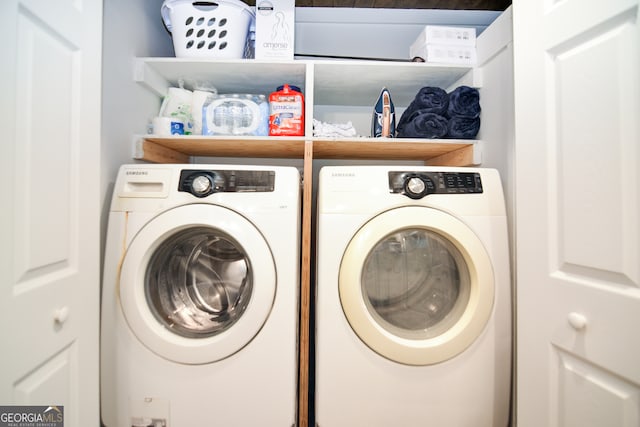 laundry room featuring washing machine and dryer