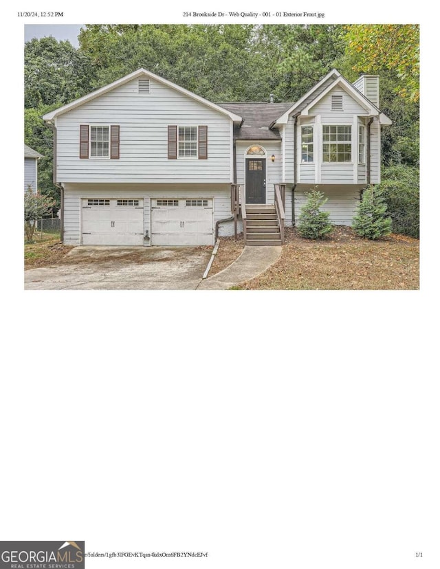 raised ranch featuring a garage