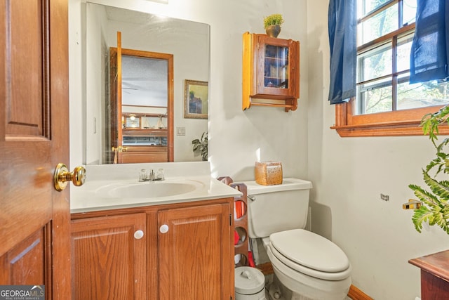 bathroom featuring vanity and toilet