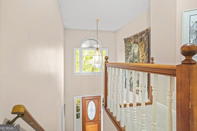 entrance foyer featuring a notable chandelier