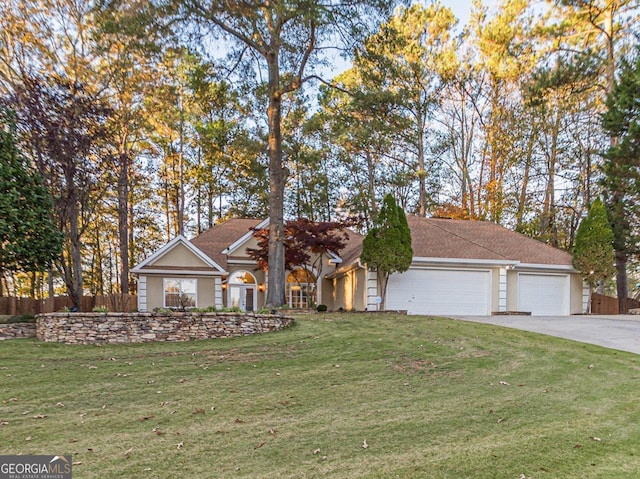 view of front of home featuring a garage and a front lawn