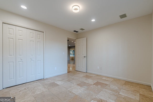 unfurnished bedroom with a closet