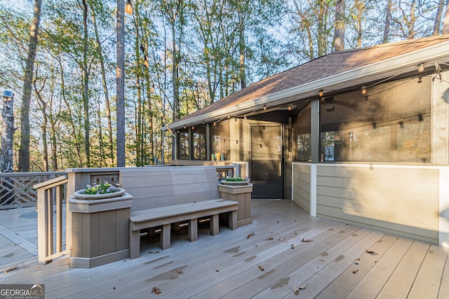 deck with a sunroom