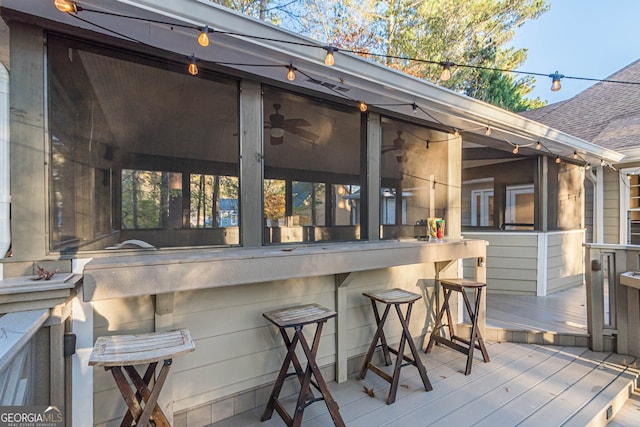 wooden deck featuring an outdoor bar