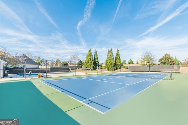 view of sport court featuring basketball hoop