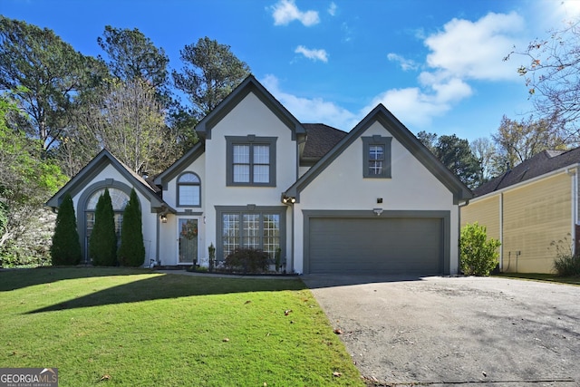 view of front facade with a front yard and a garage