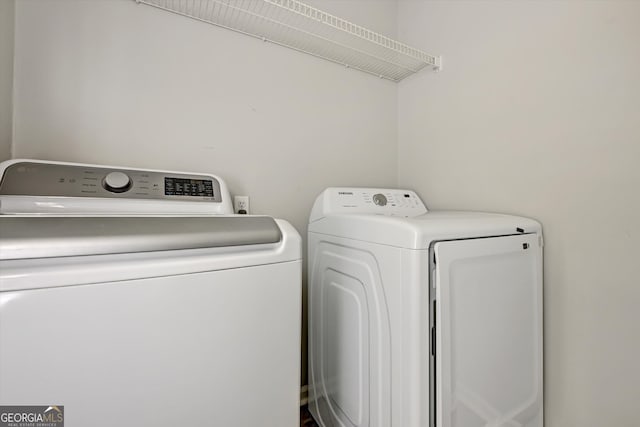 washroom with separate washer and dryer