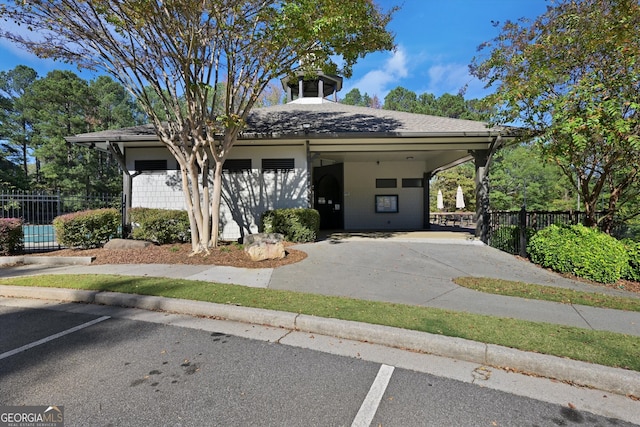 view of front of property featuring a carport