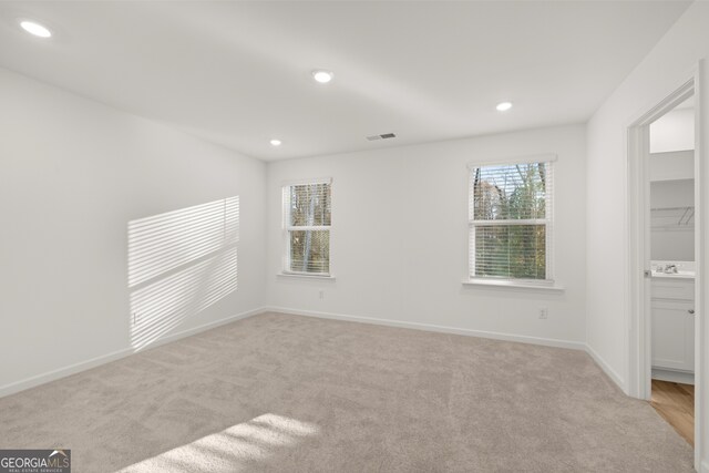 living room featuring light hardwood / wood-style flooring and sink