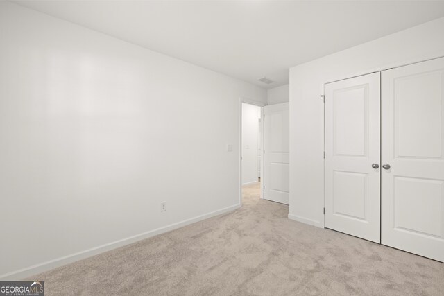 bathroom featuring hardwood / wood-style floors, vanity, and a shower with shower door