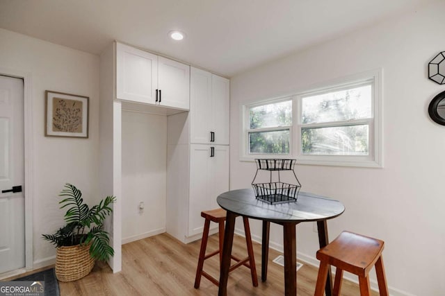 dining space featuring light hardwood / wood-style flooring