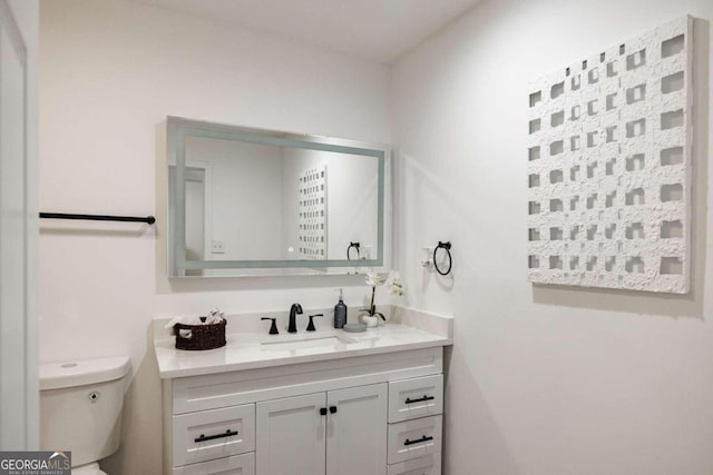 bathroom with vanity and toilet