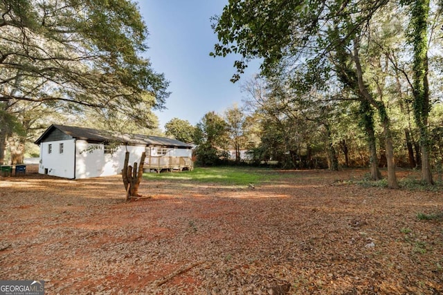 view of yard featuring a deck