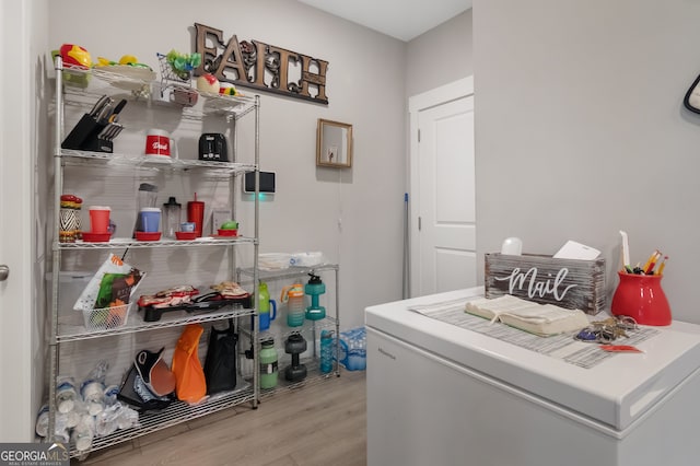 washroom with light hardwood / wood-style flooring