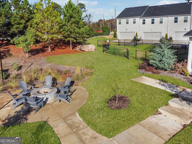 view of yard with an outdoor fire pit and a patio area