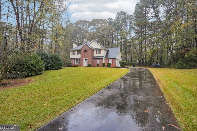 view of front of property with a front lawn