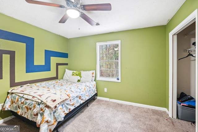 bedroom with light carpet, a closet, and ceiling fan